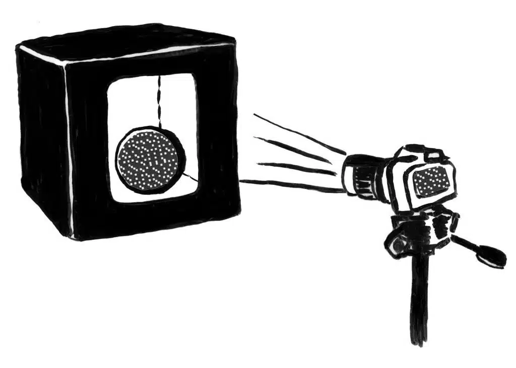 Zeichnung einer Kamera, die ein Objekt fotografiert, welches in einer Lichtbox positioniert ist,